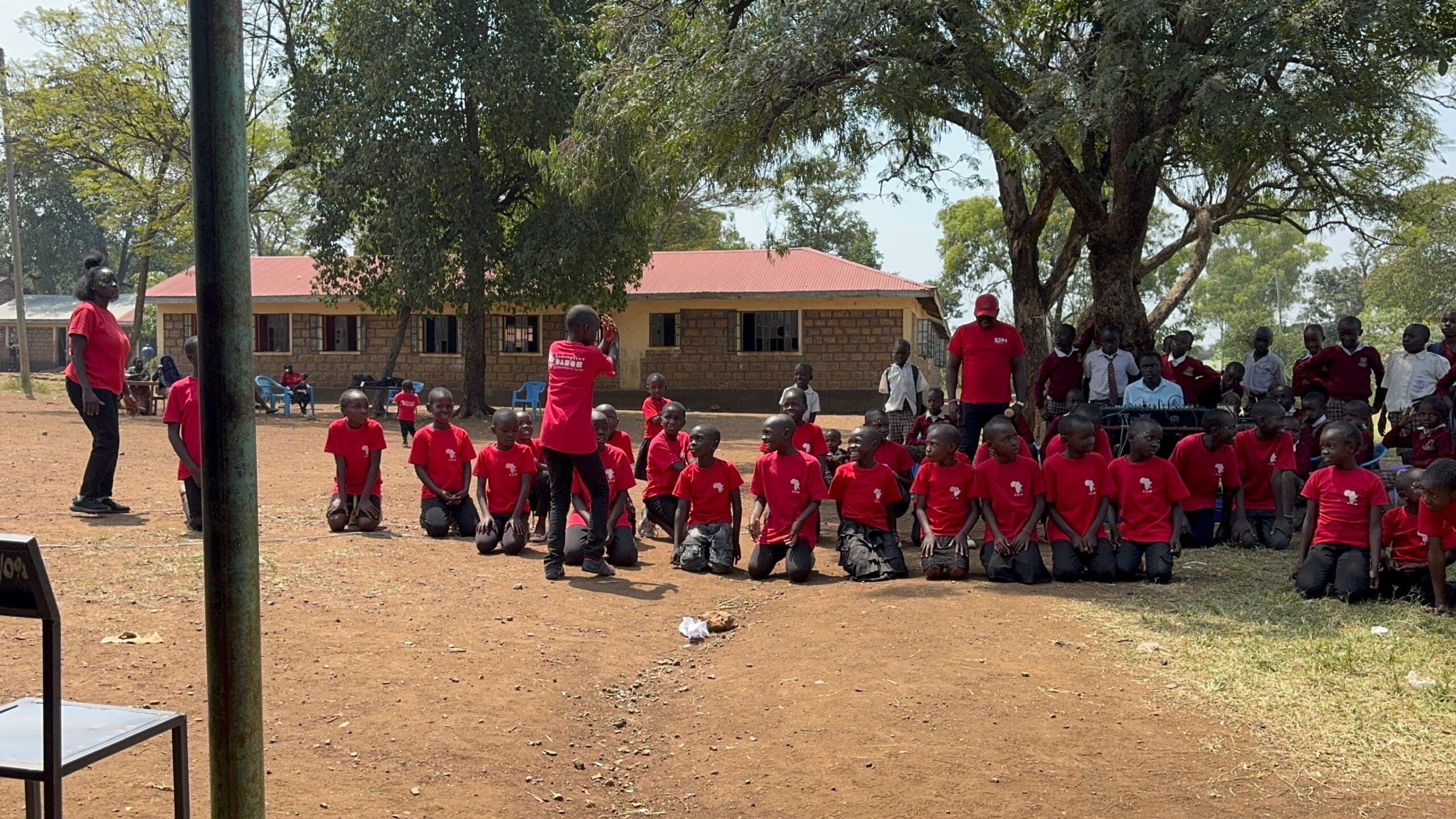 Redemptive Dance Ministries leaders and children gathered at a school in Kenya