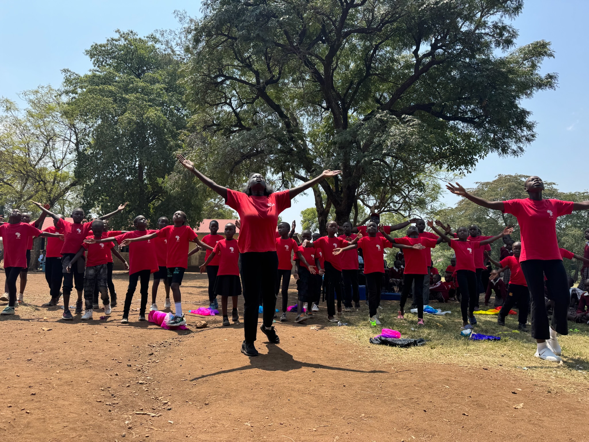 Redemptive Dance Ministries dancers worshiping together with arms raised
