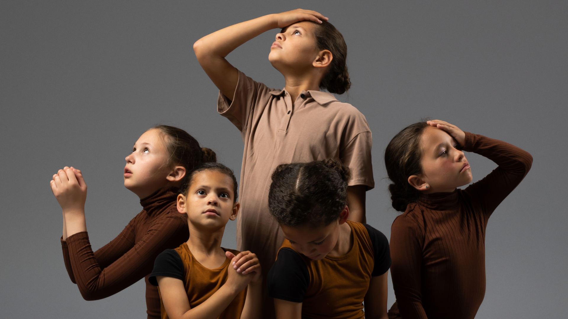 Young dancers of Redemptive Dance Ministries looking upward in worship
